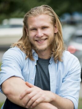 front-view-smiley-man-outdoors