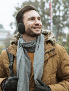 man-outdoors-winter-wearing-ear-muffs