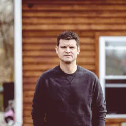 selective-focus-shot-serious-man-posing-seriously-scaled-250x250